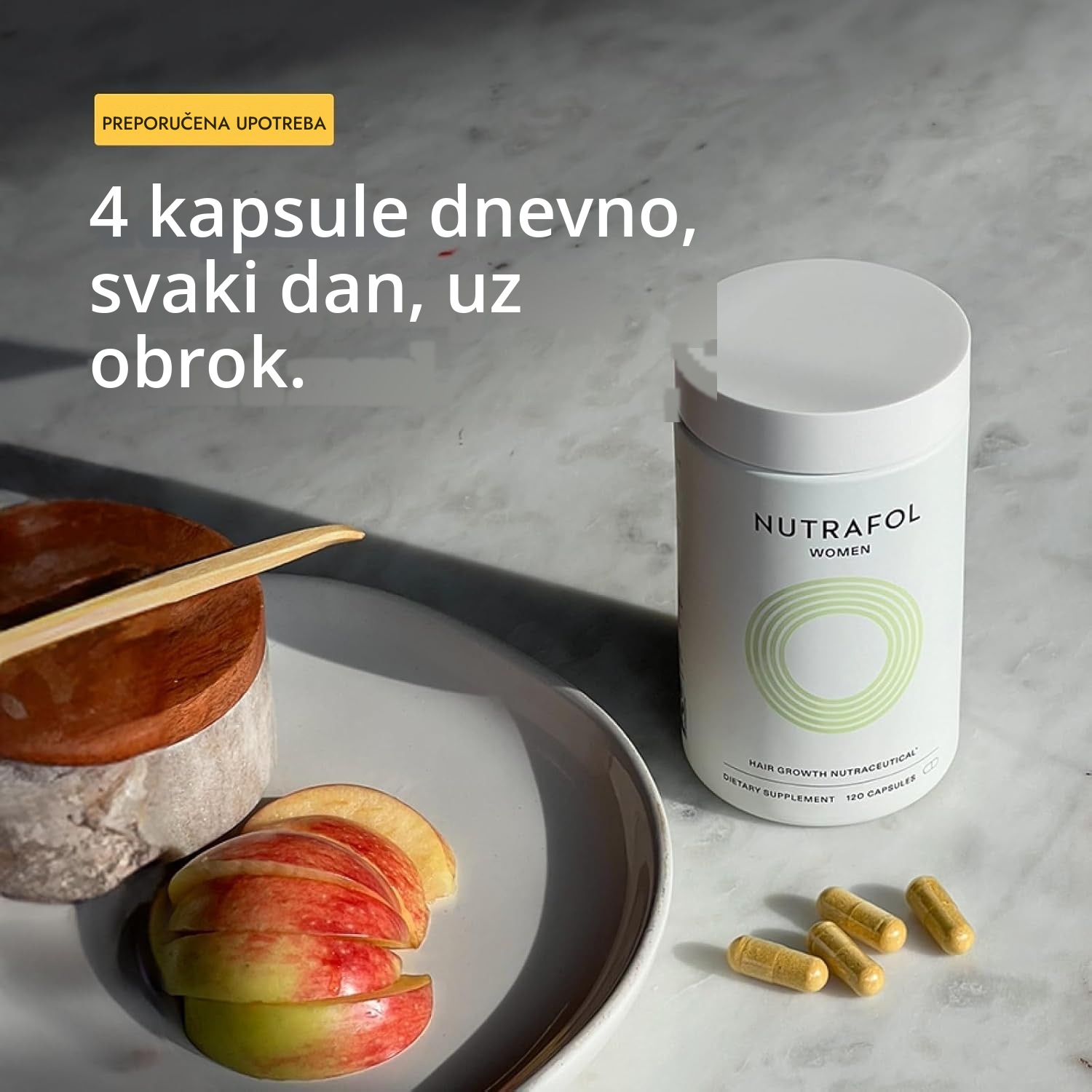 Nutrafol kutija za žene 18-44 s kapsulama pored nje