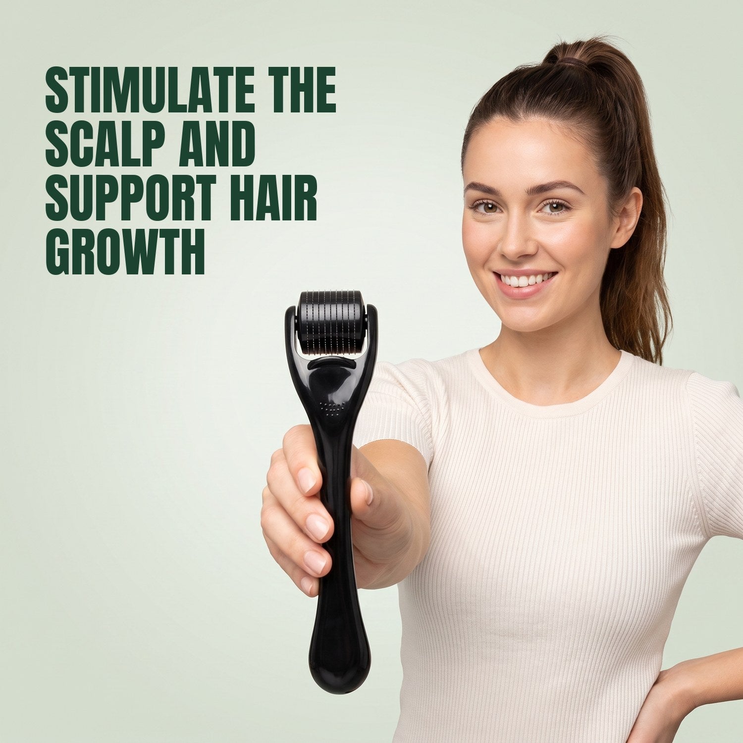 Woman holding a 540-needle dermaroller against a green background
