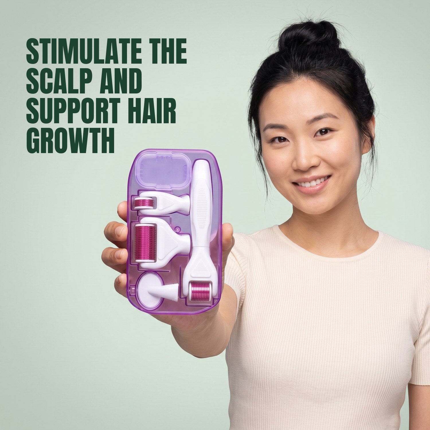 Woman holding a 6-in-1 dermaroller kit against a green background