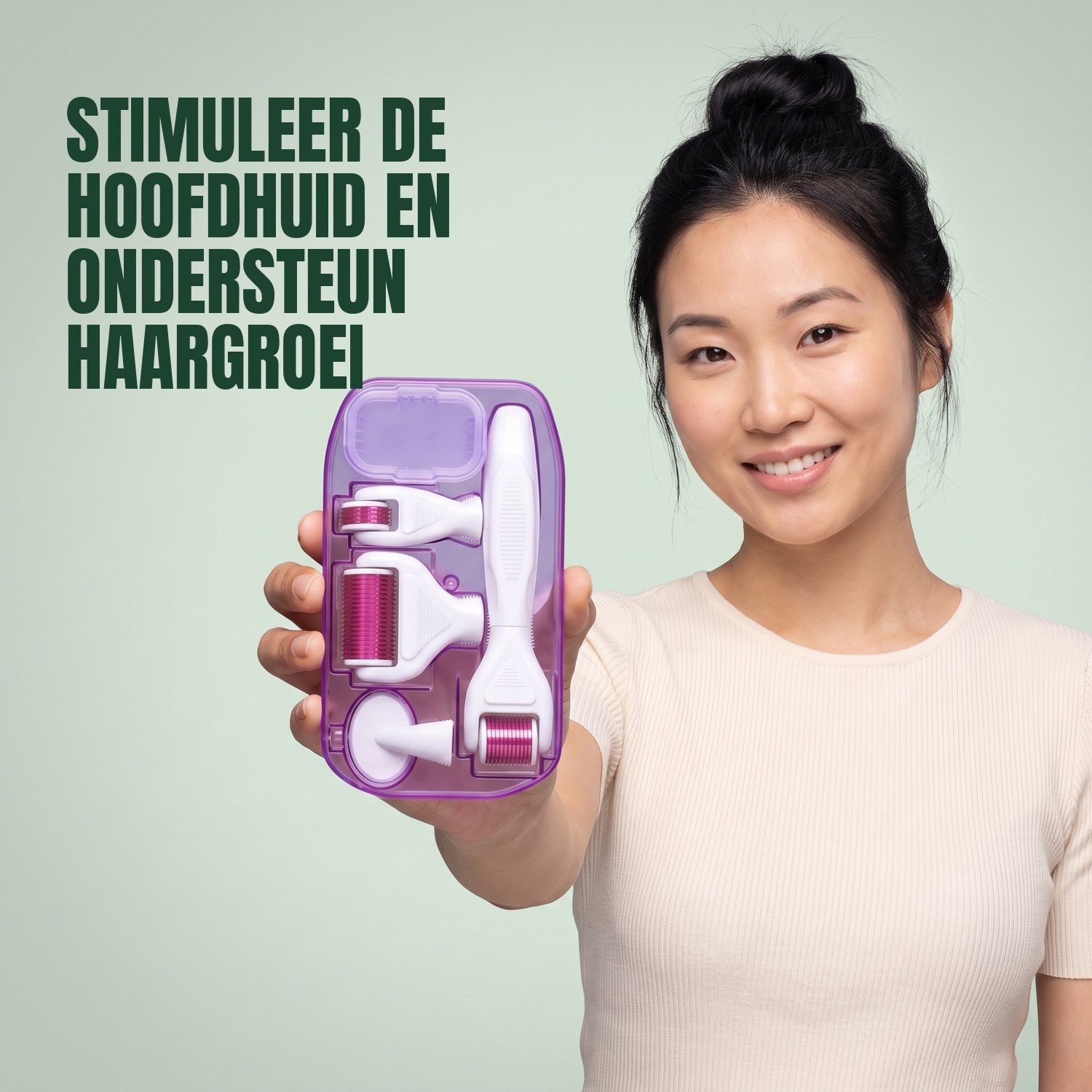 Woman holding a 6-in-1 dermaroller kit against a green background