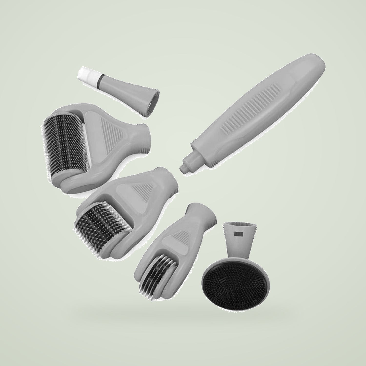 The 6-in-1 dermaroller kit in black: handle, four roller heads, applicator tip and silicone brush