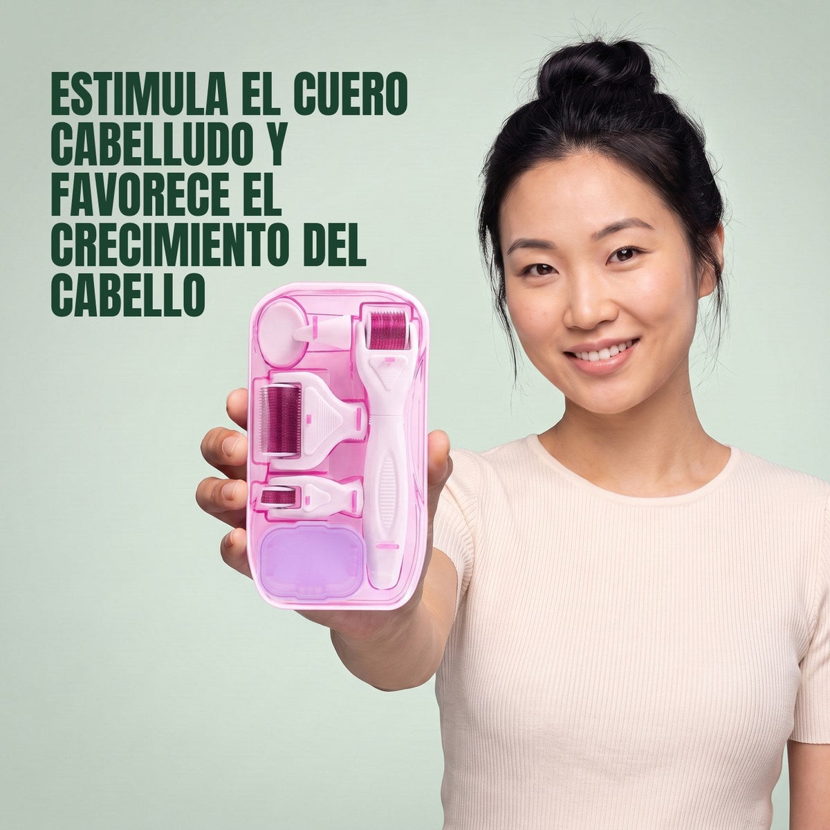 Woman holding the pink 6-in-1 dermaroller kit against a green background