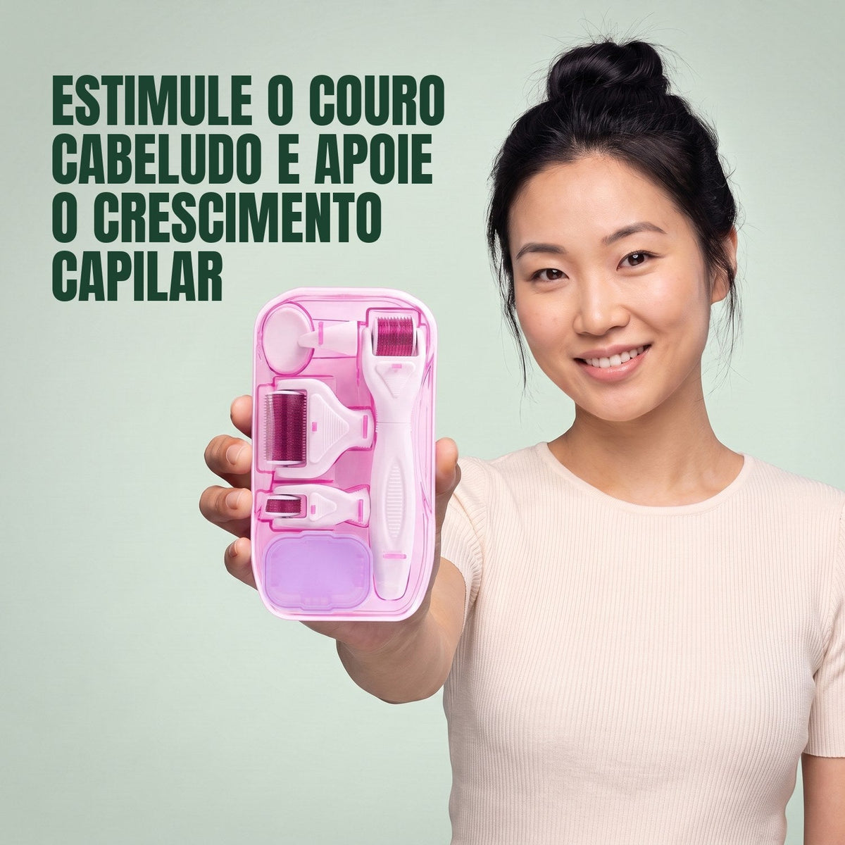 Woman holding the pink 6-in-1 dermaroller kit against a green background