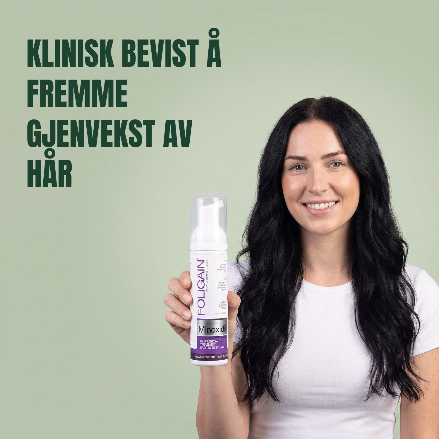 Woman holding the Foligain Minoxidil 2% foam can for women against a green background