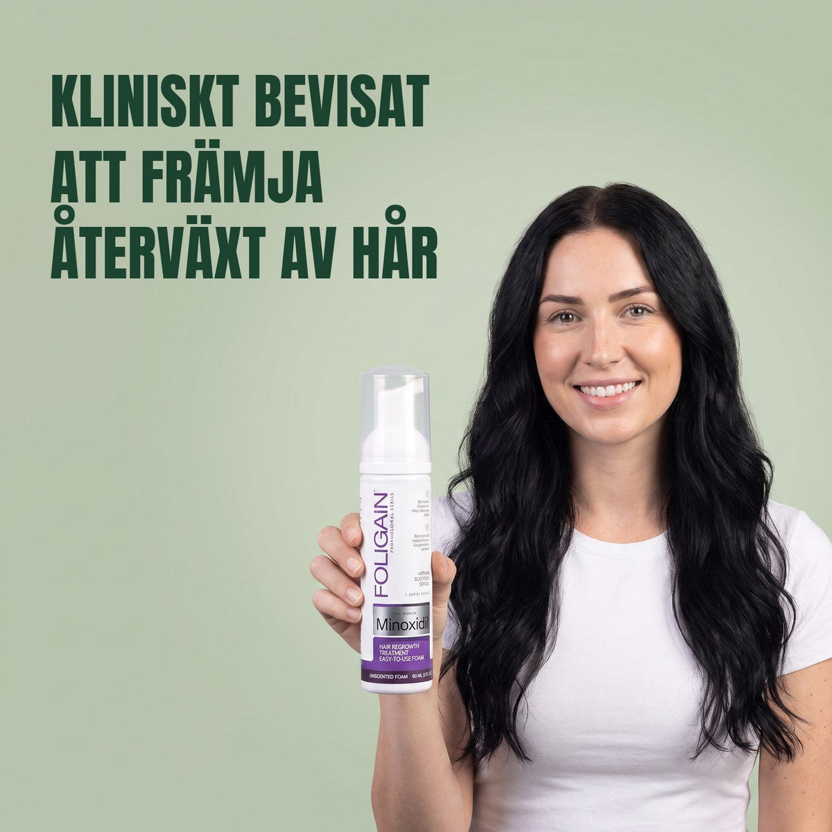 Woman holding the Foligain Minoxidil 2% foam can for women against a green background