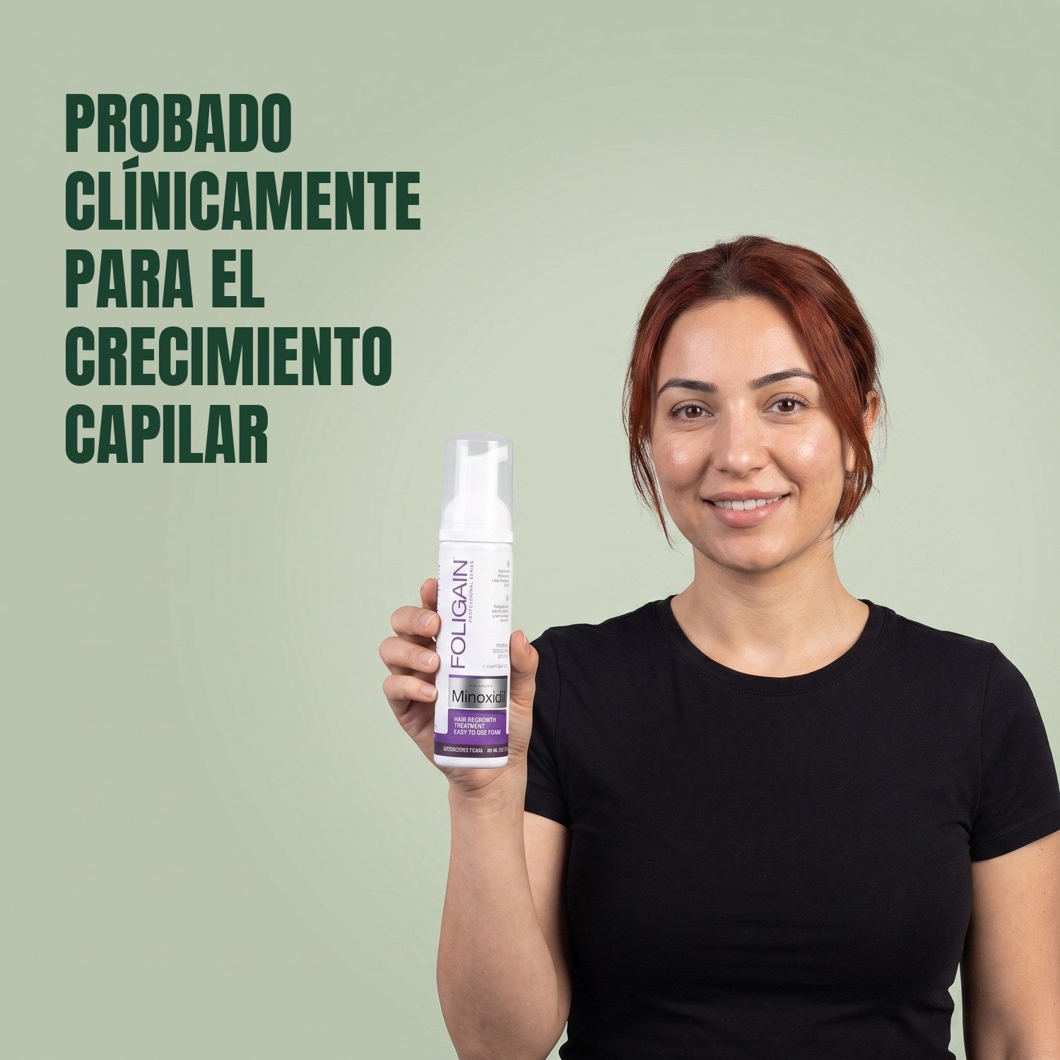 Woman holding the Foligain Minoxidil 2% foam can for women against a green background