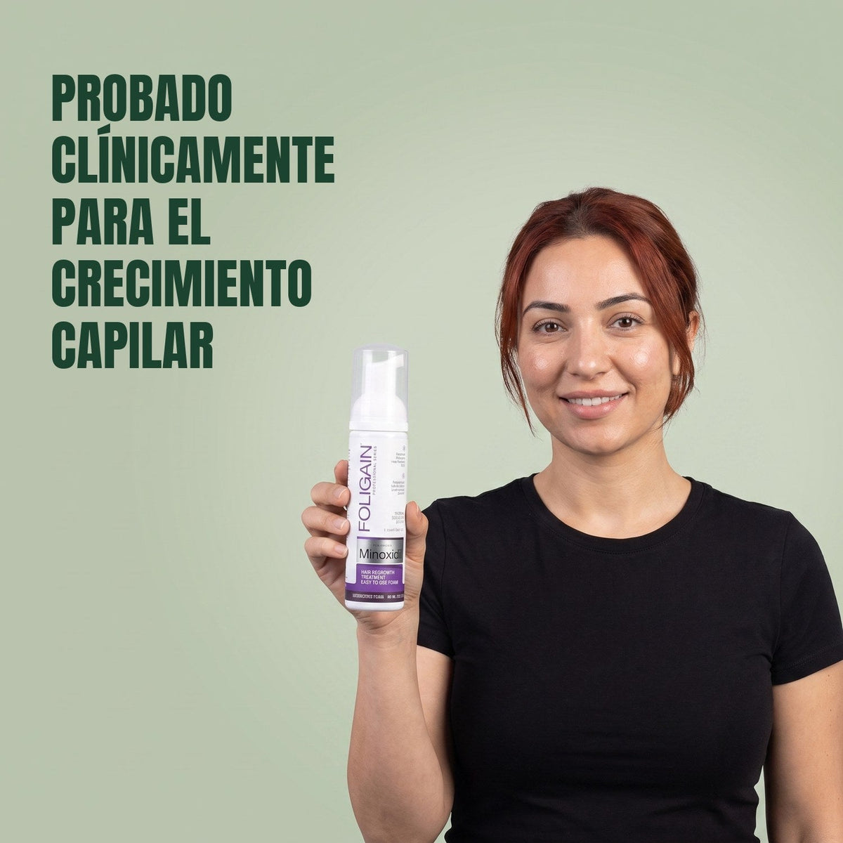 Woman holding the Foligain Minoxidil 2% foam can for women against a green background