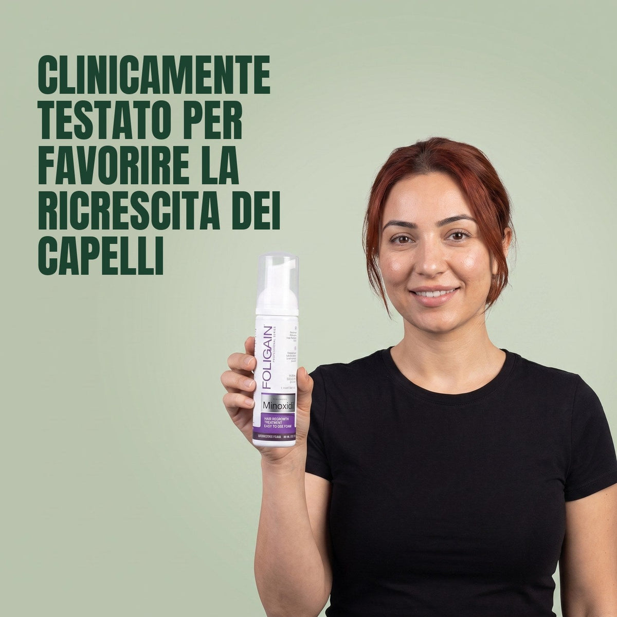 Woman holding the Foligain Minoxidil 2% foam can for women against a green background