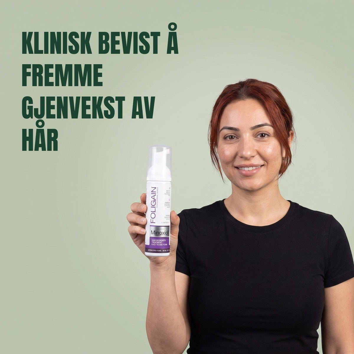 Woman holding the Foligain Minoxidil 2% foam can for women against a green background