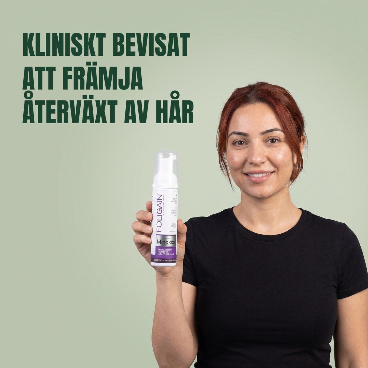 Woman holding the Foligain Minoxidil 2% foam can for women against a green background