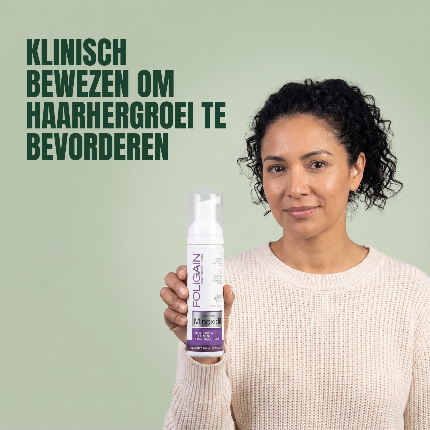 Woman holding the Foligain Minoxidil 2% foam can for women against a green background