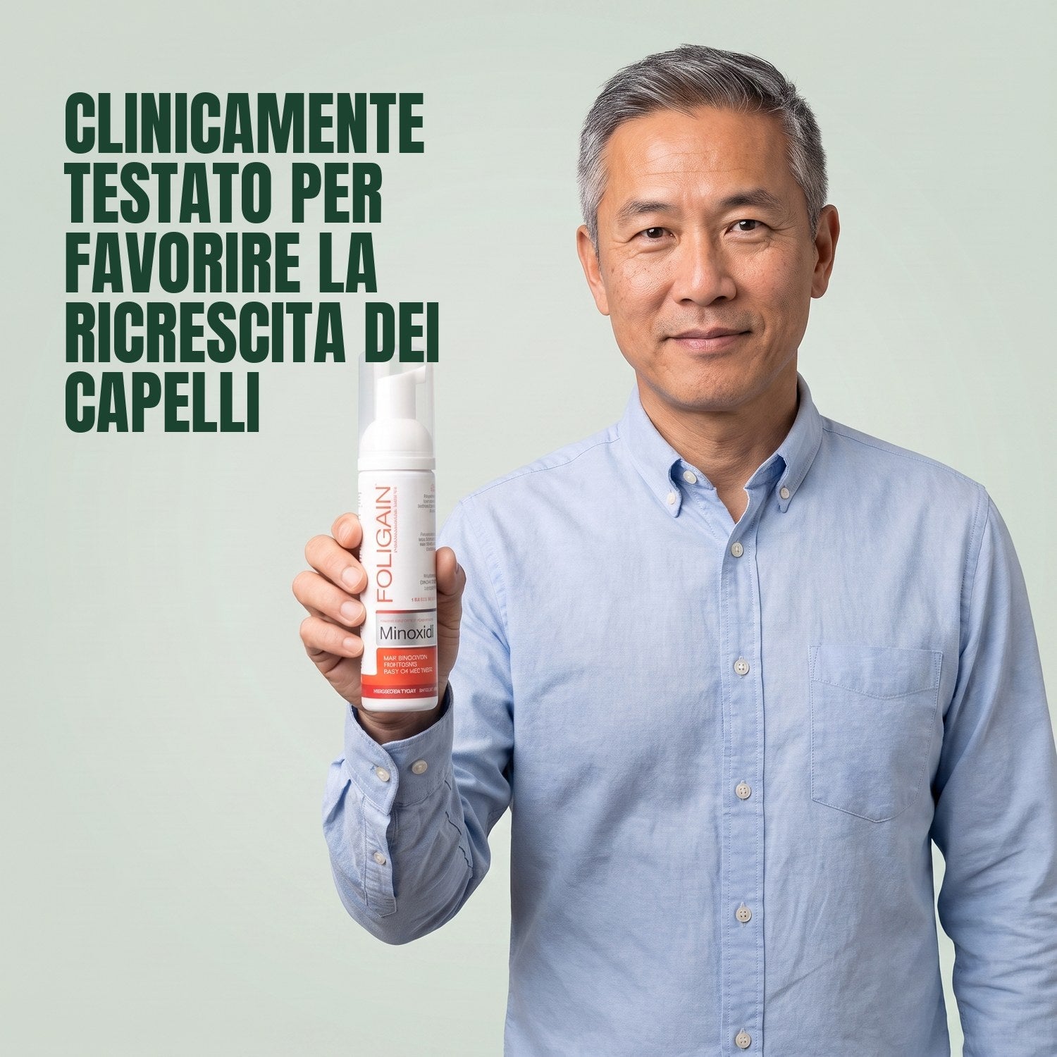 Man holding the Foligain Minoxidil 5% foam can for men against a green background