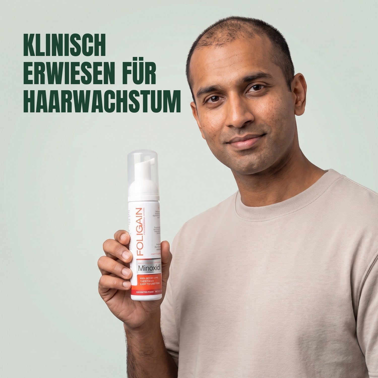 Man holding the Foligain Minoxidil 5% foam can for men against a green background