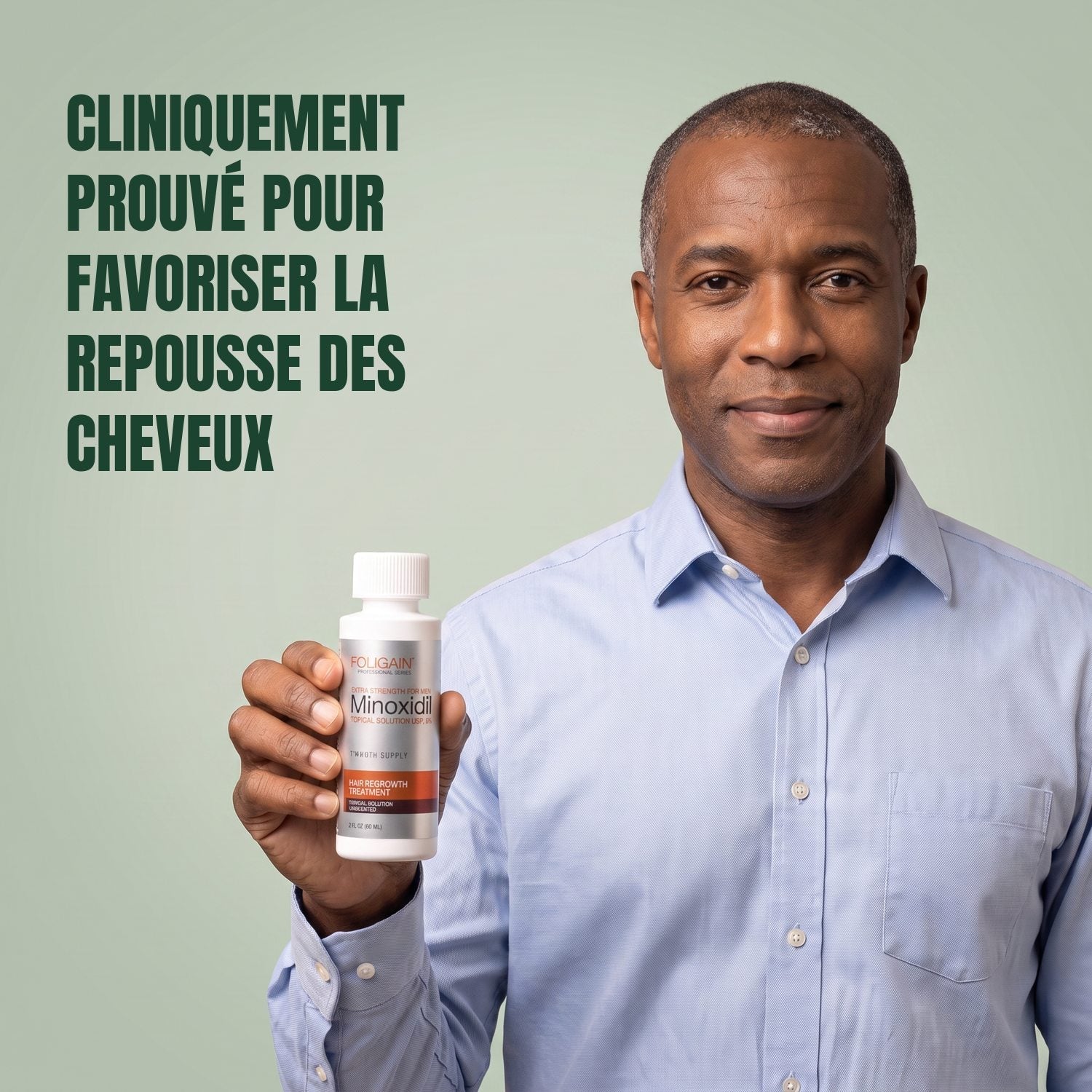 Man holding the Foligain Minoxidil 5% lotion bottle for men against a green background