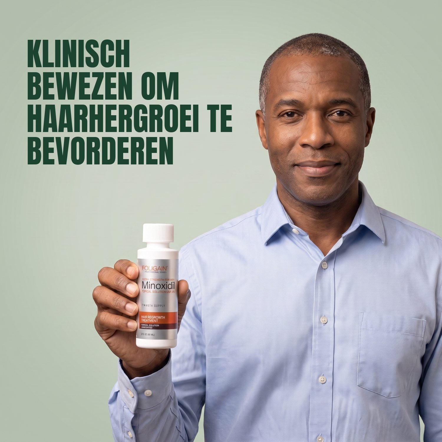 Man holding the Foligain Minoxidil 5% lotion bottle for men against a green background