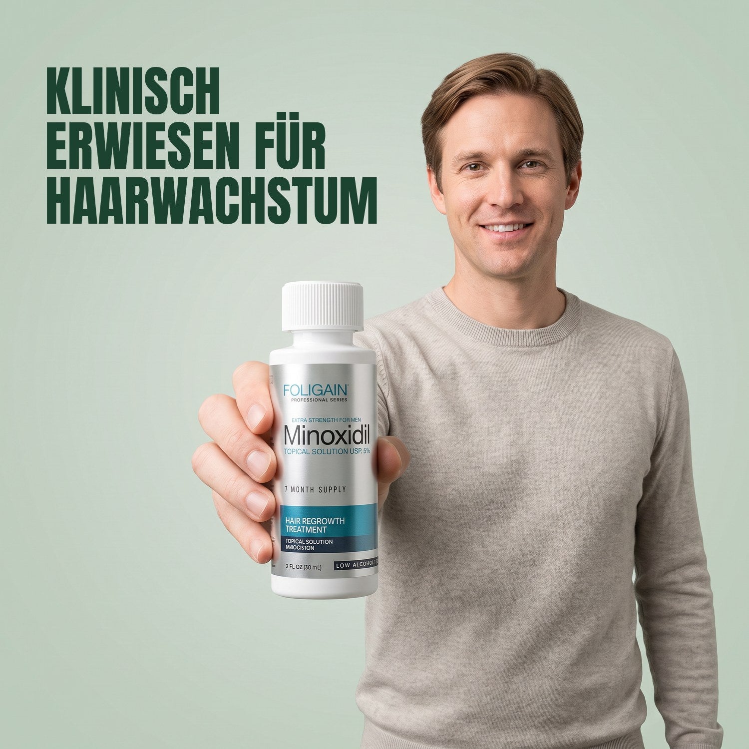 Man holding a Foligain Minoxidil 5% sensitive skin lotion bottle against a green background