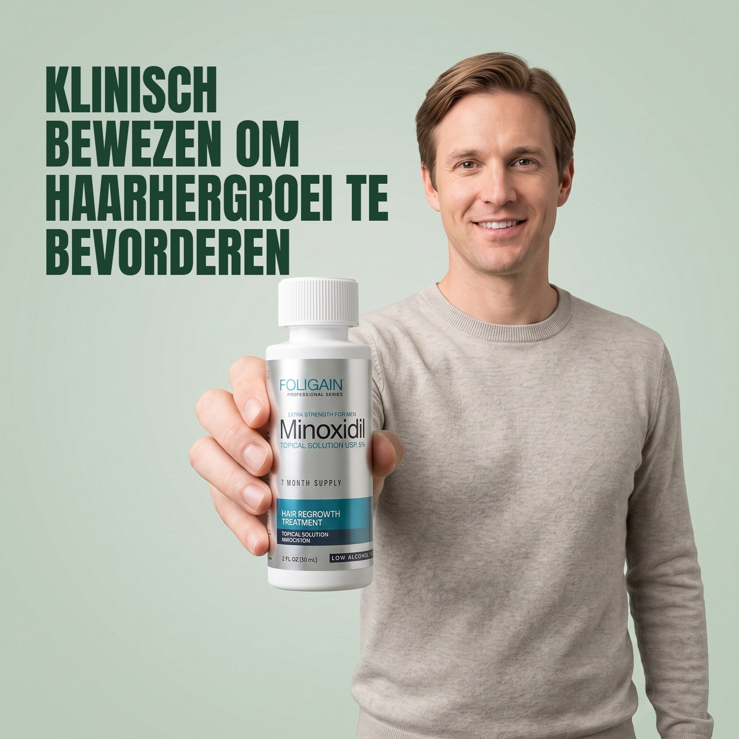 Man holding a Foligain Minoxidil 5% sensitive skin lotion bottle against a green background