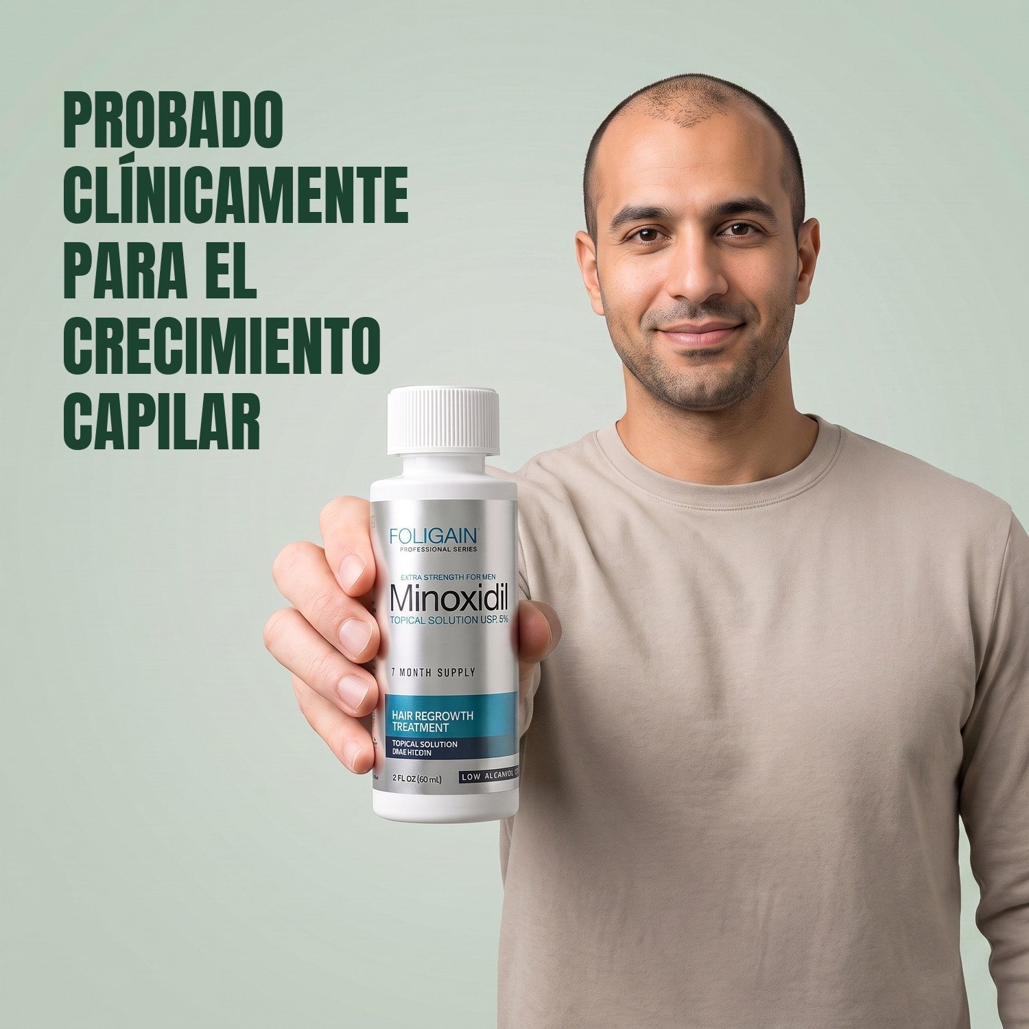 Man holding the Foligain Minoxidil 5% sensitive skin lotion bottle for men against a green background