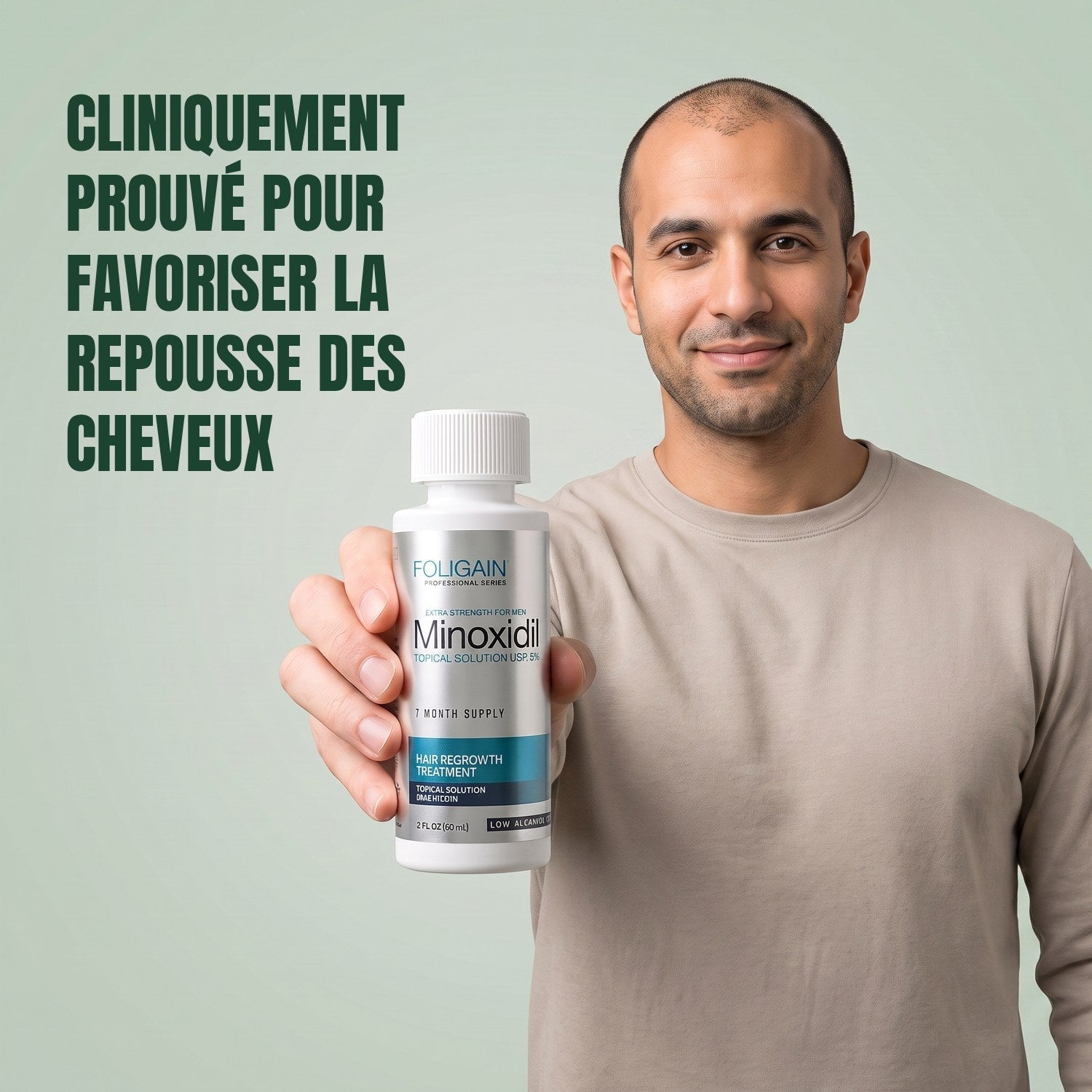Man holding the Foligain Minoxidil 5% sensitive skin lotion bottle for men against a green background
