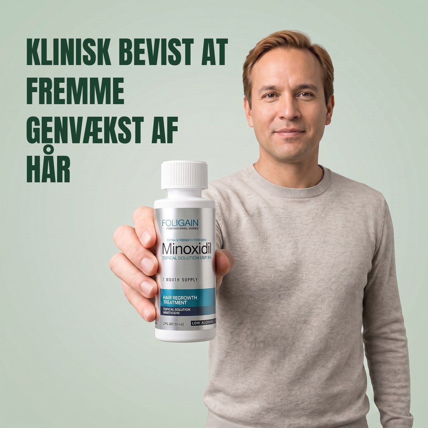 Man holding the Foligain Minoxidil 5% sensitive skin lotion bottle for men against a green background