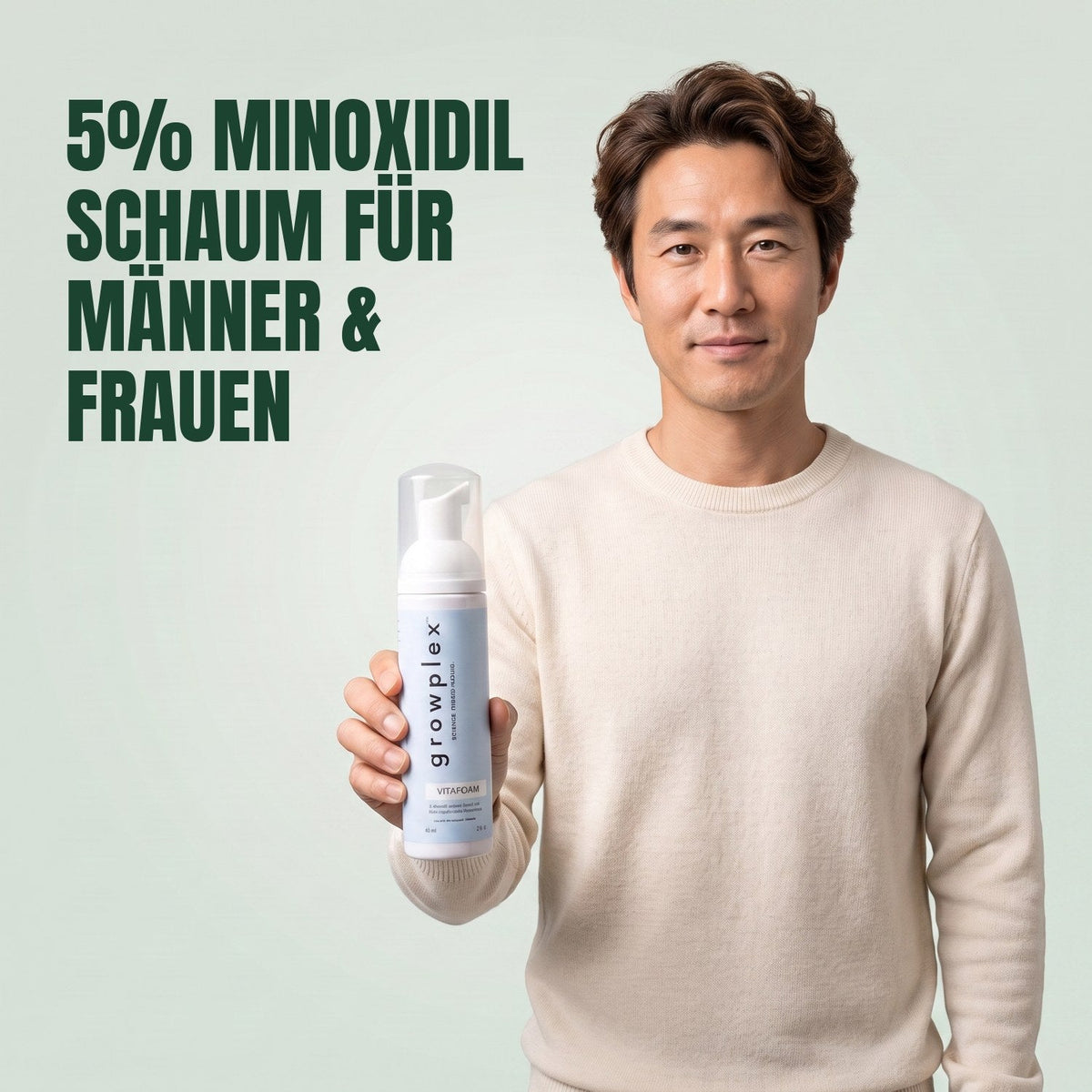 Man holding the Growplex VitaFoam minoxidil 5% foam bottle against a green background