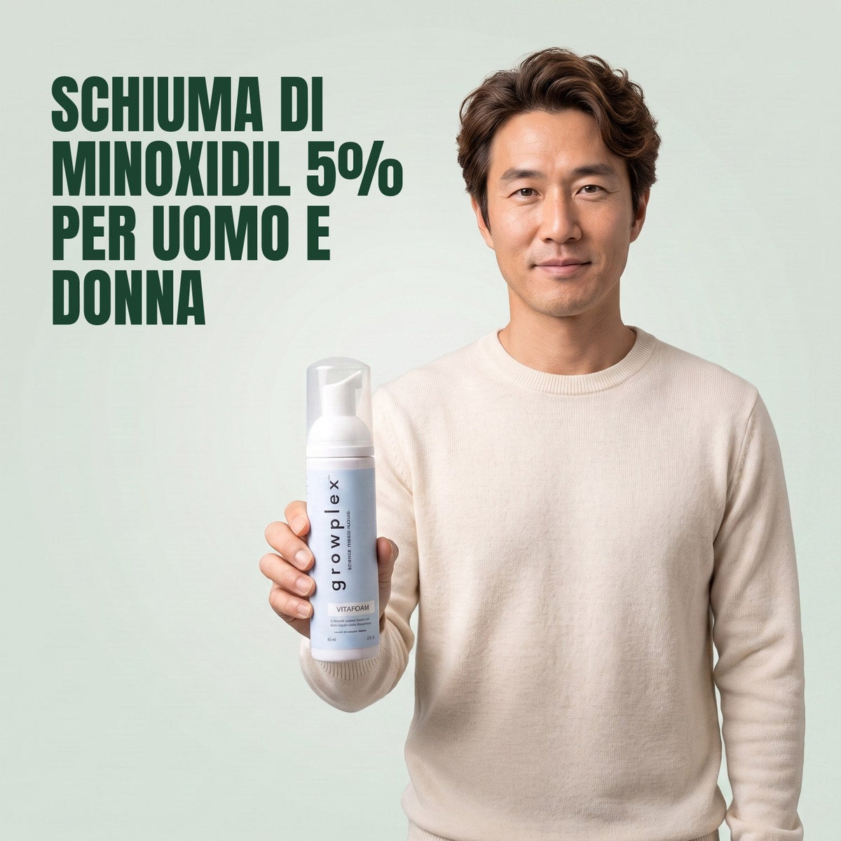 Man holding the Growplex VitaFoam minoxidil 5% foam bottle against a green background