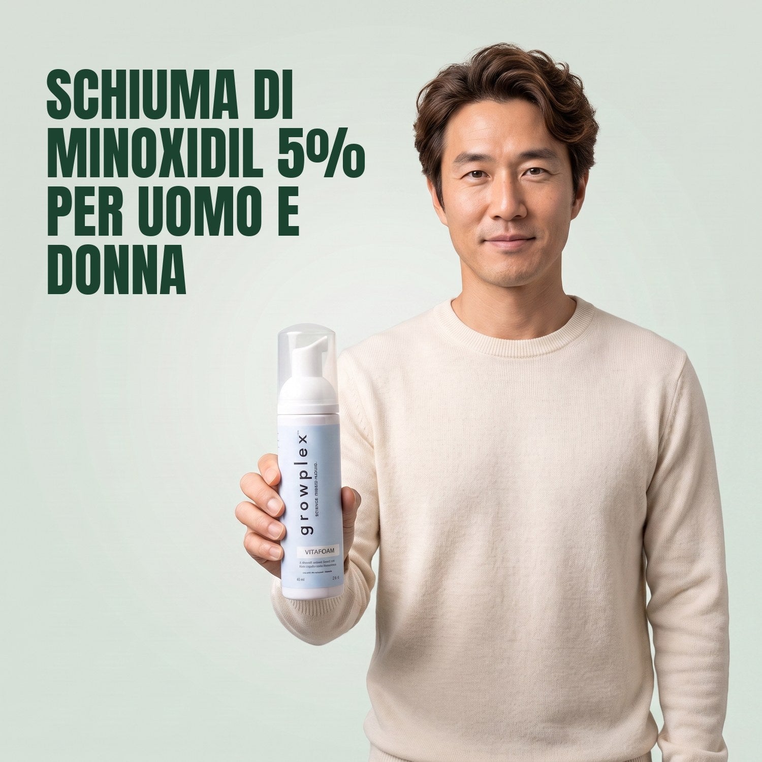 Man holding the Growplex VitaFoam minoxidil 5% foam bottle against a green background