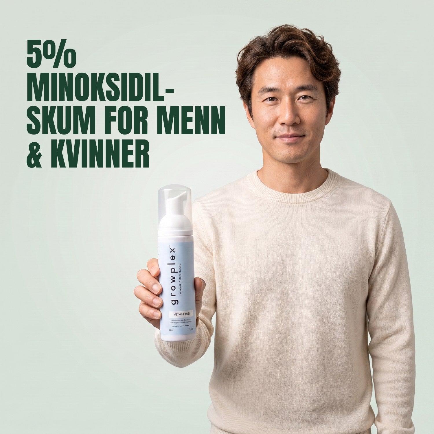 Man holding the Growplex VitaFoam minoxidil 5% foam bottle against a green background