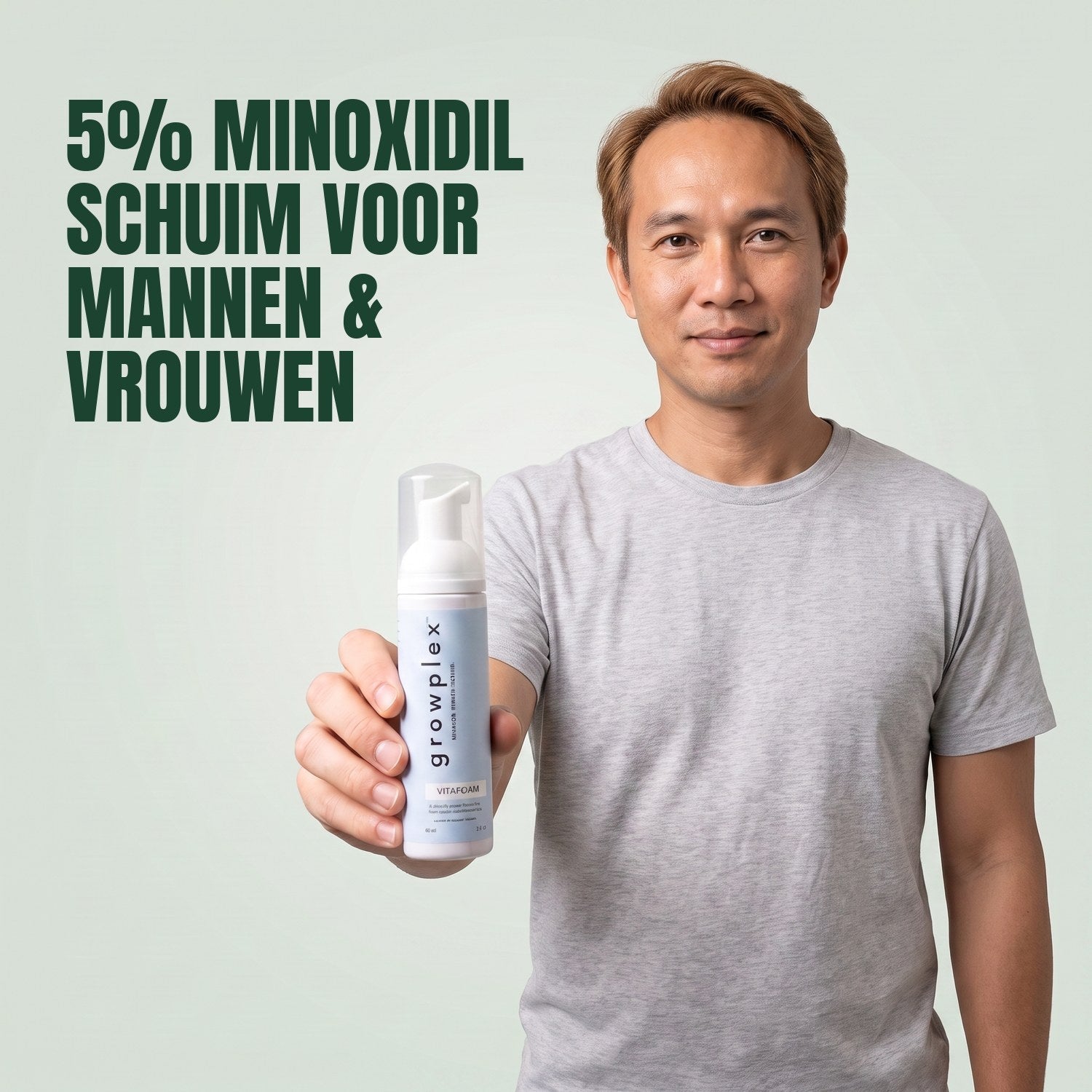 Man holding the Growplex VitaFoam minoxidil 5% foam bottle against a green background