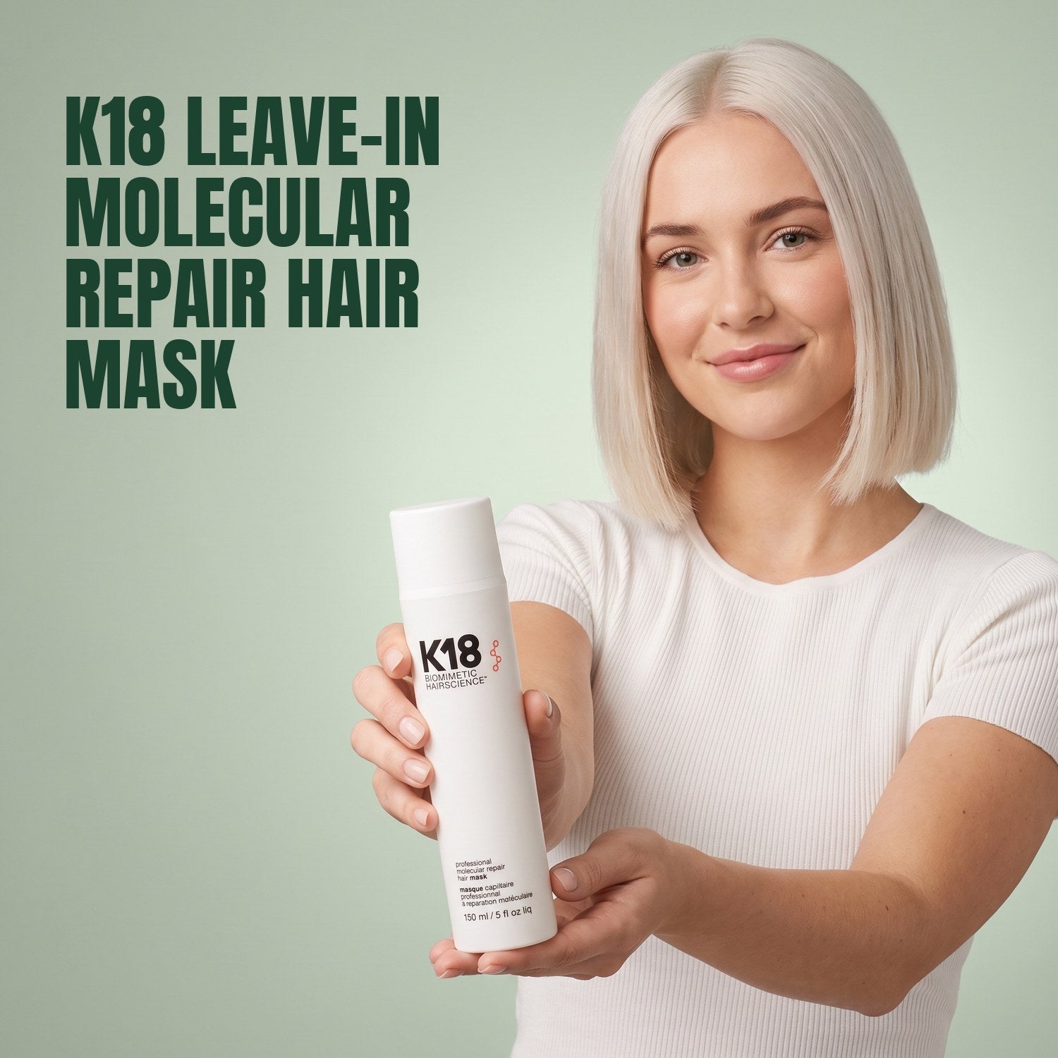 Woman holding K18 Leave-In Molecular Repair Hair Mask against a green background