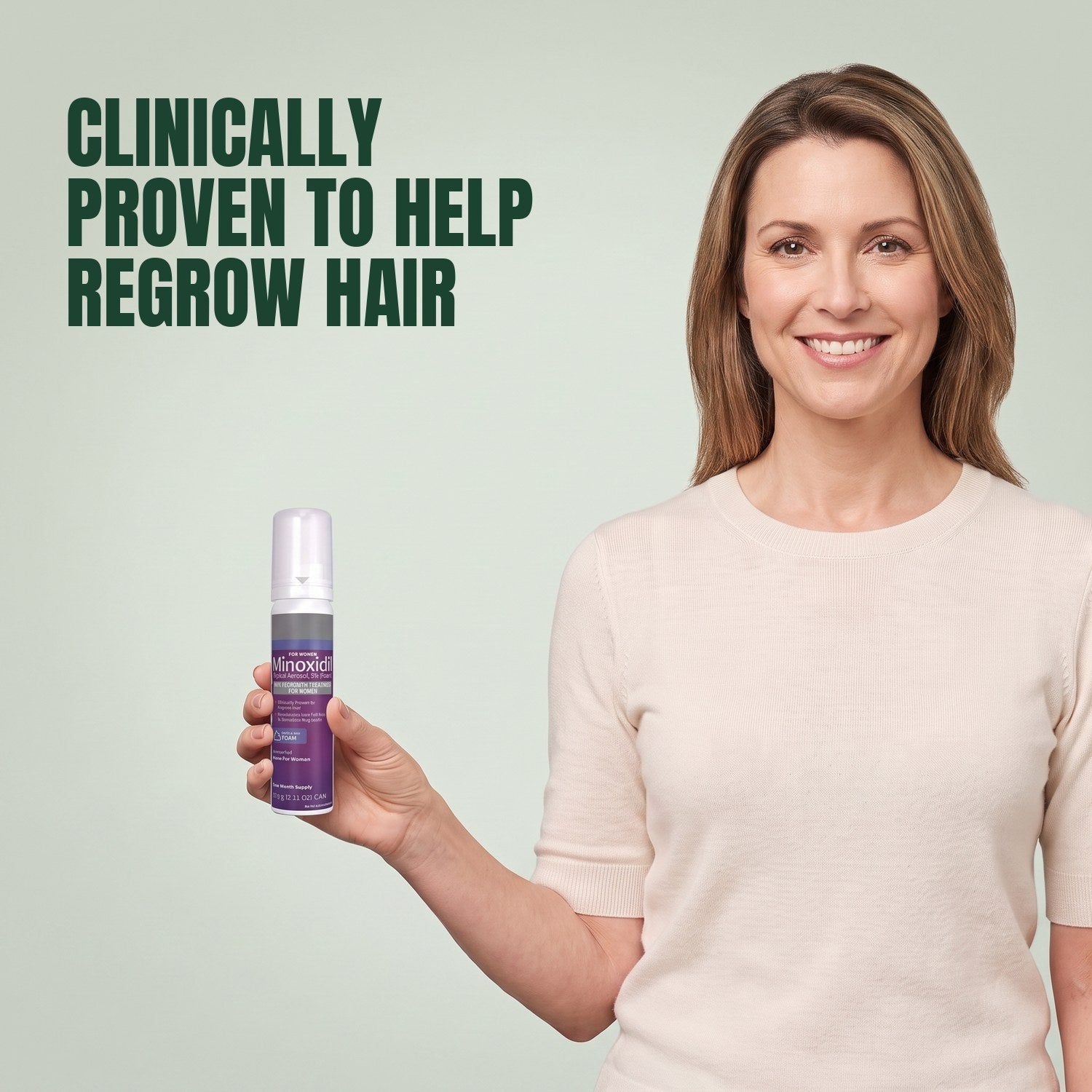 Woman holding a Kirkland Signature Minoxidil 5% foam can for women against a green background