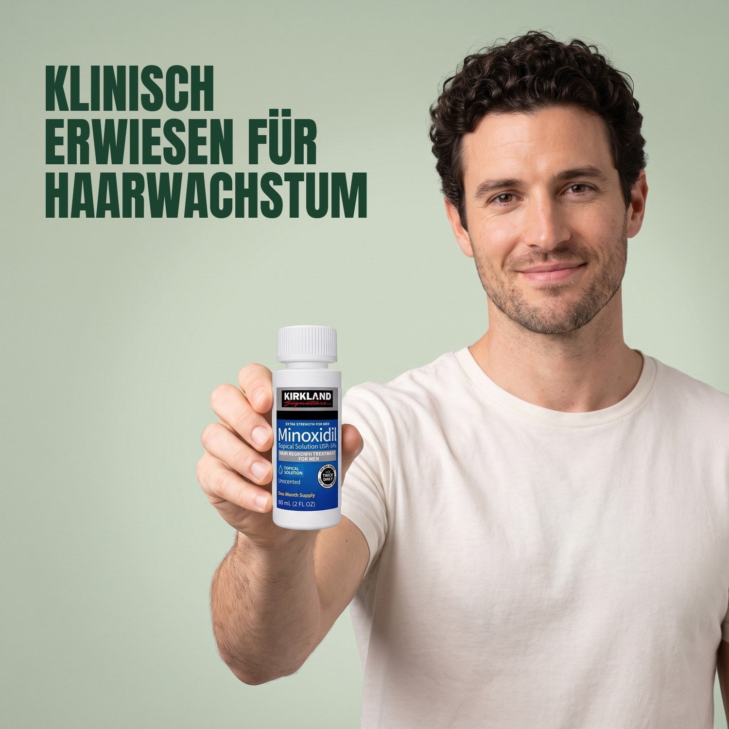 Man holding a Kirkland Signature Minoxidil 5% lotion bottle against a green background