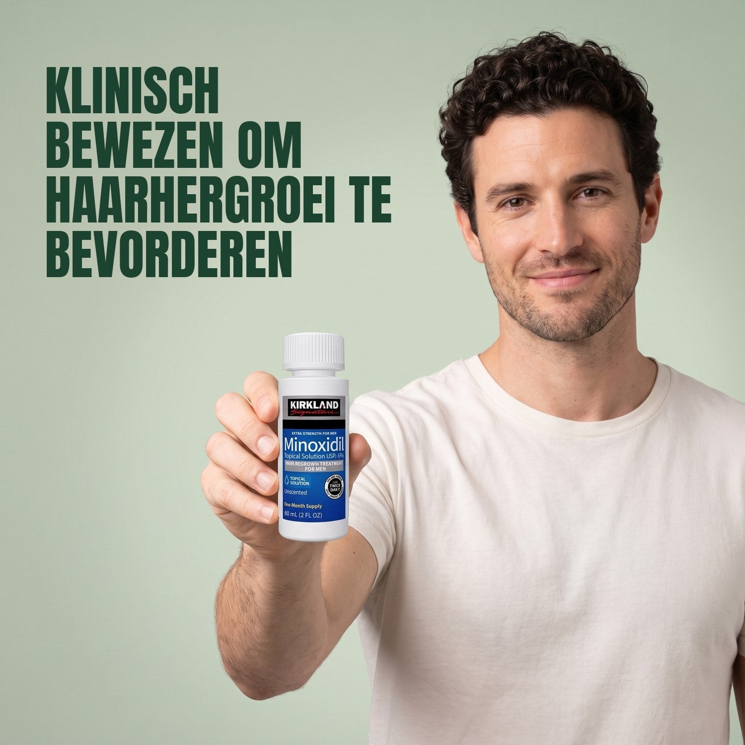Man holding a Kirkland Signature Minoxidil 5% lotion bottle against a green background