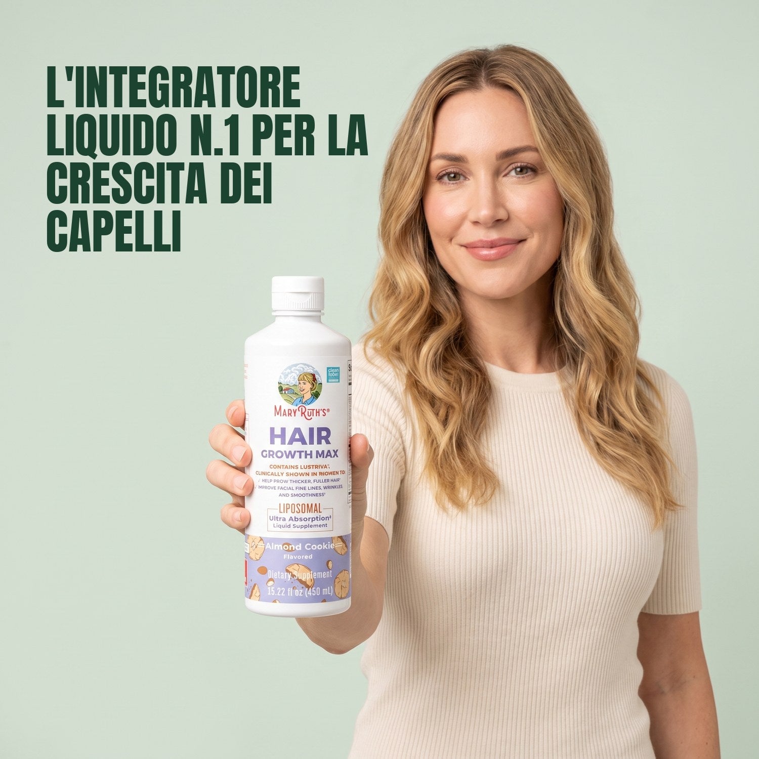 Woman holding a MaryRuth Organics Hair Growth Max Liposomal bottle against a green background