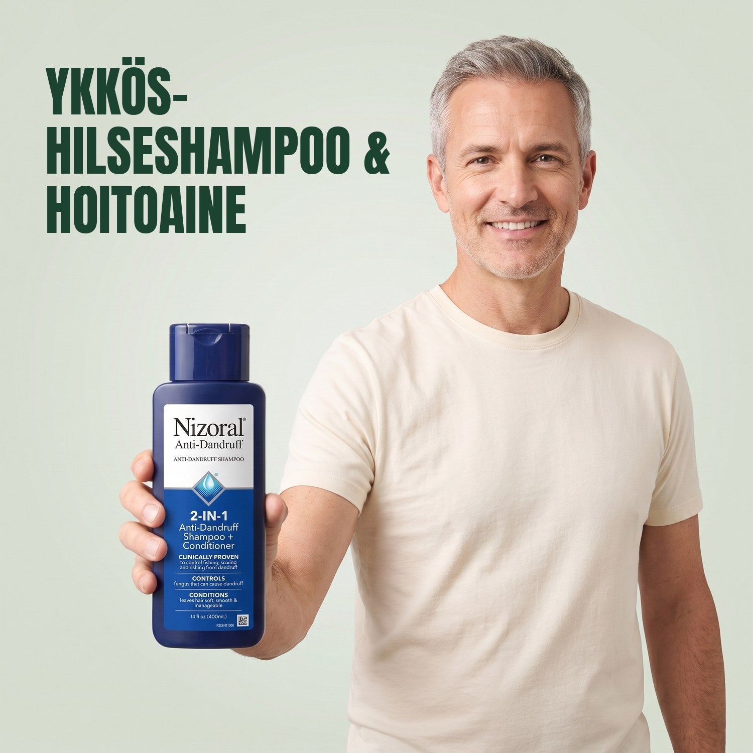 Mies pitelee Nizoral 2-in-1-hilseshampoo- ja hoitoainepulloa vihreää taustaa vasten