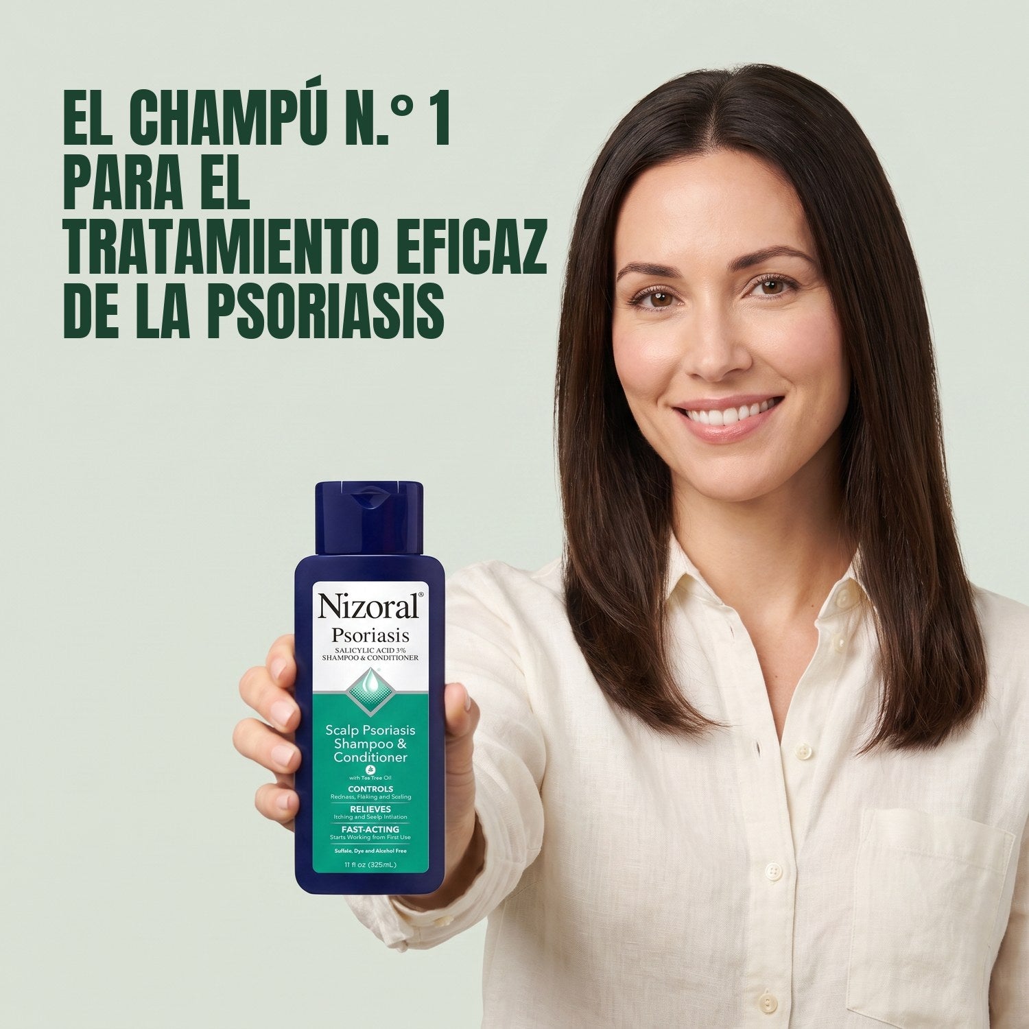 Woman holding Nizoral scalp psoriasis shampoo and conditioner against a green background