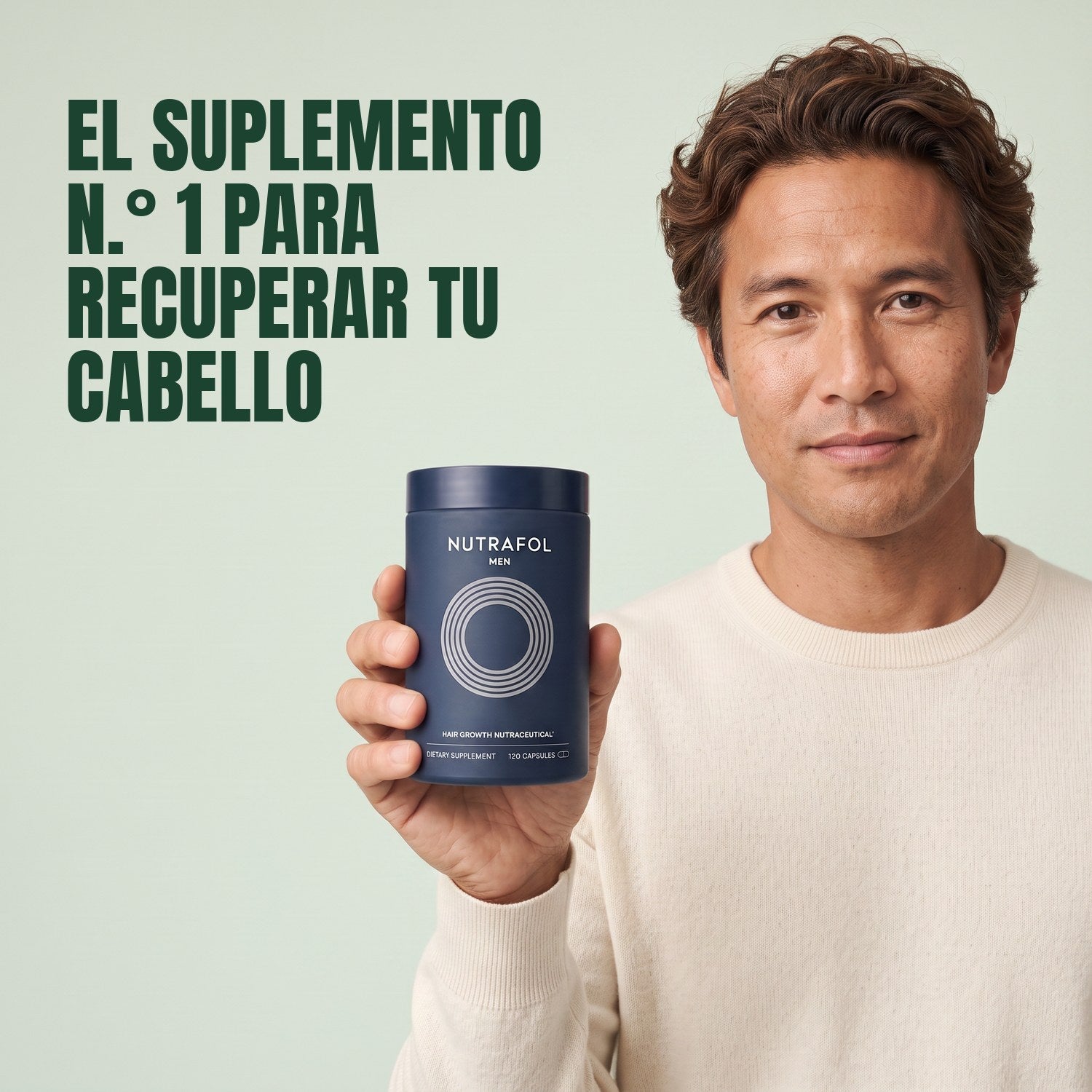 Man holding the Nutrafol for Men supplement box against a green background