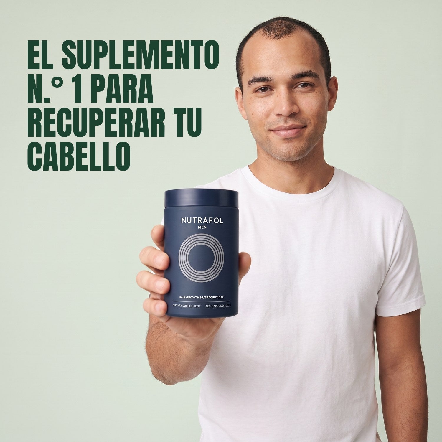 Man holding the Nutrafol for Men supplement box against a green background
