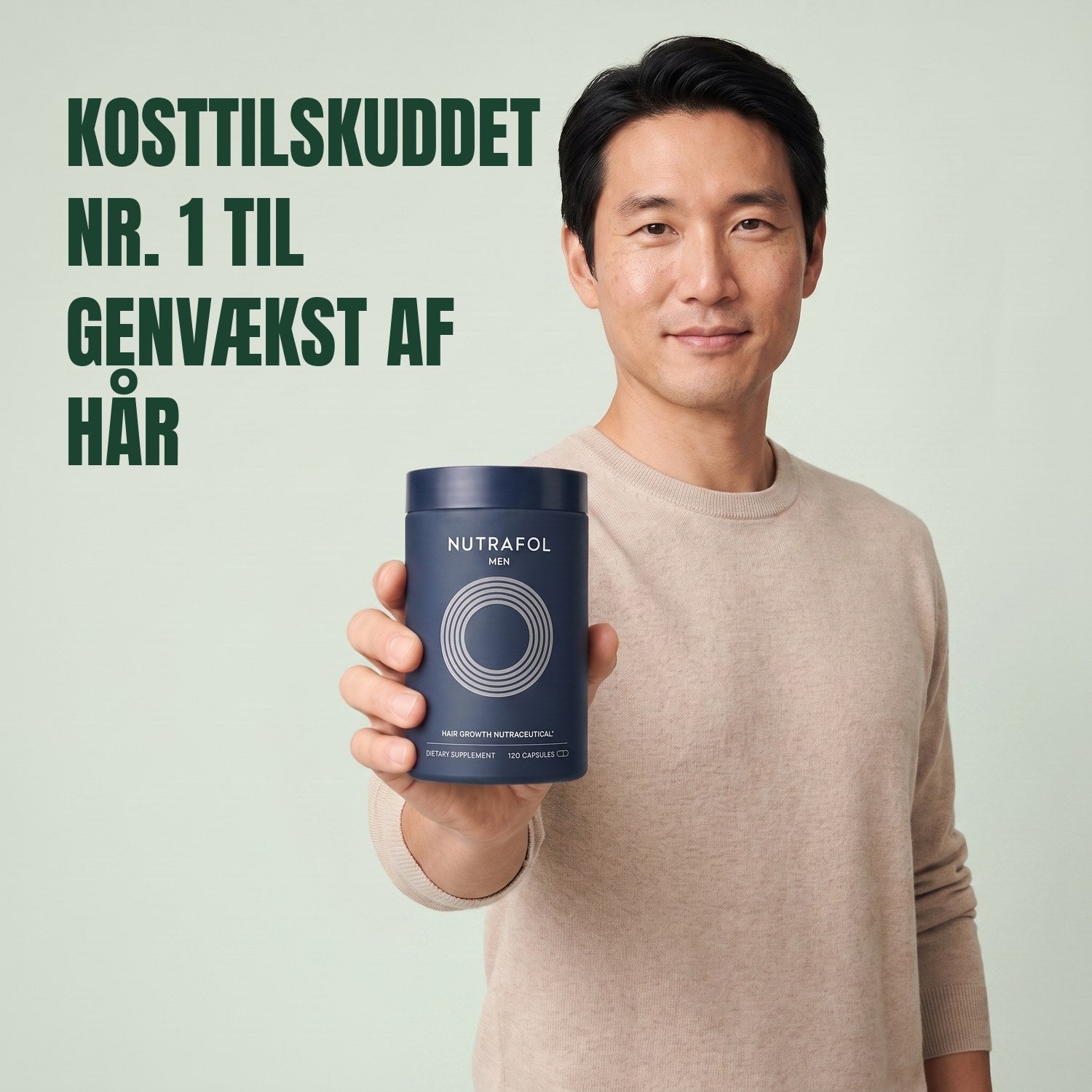 Man holding the Nutrafol for Men supplement box against a green background