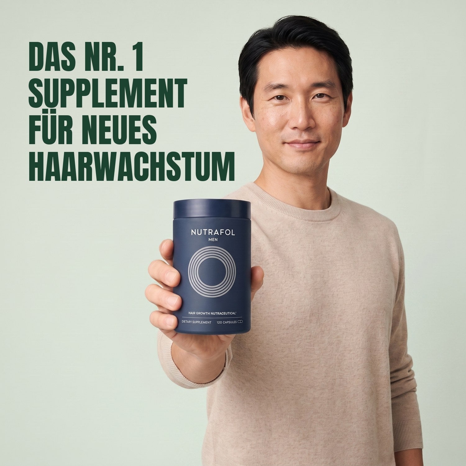 Man holding the Nutrafol for Men supplement box against a green background
