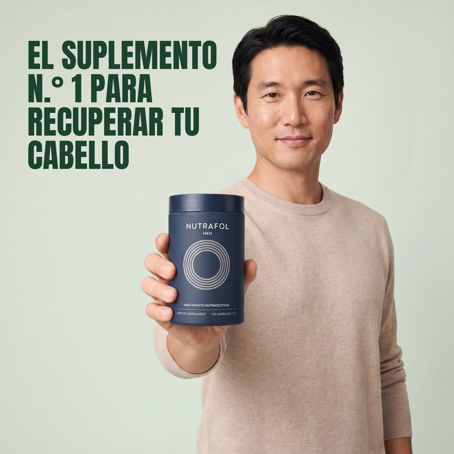 Man holding the Nutrafol for Men supplement box against a green background