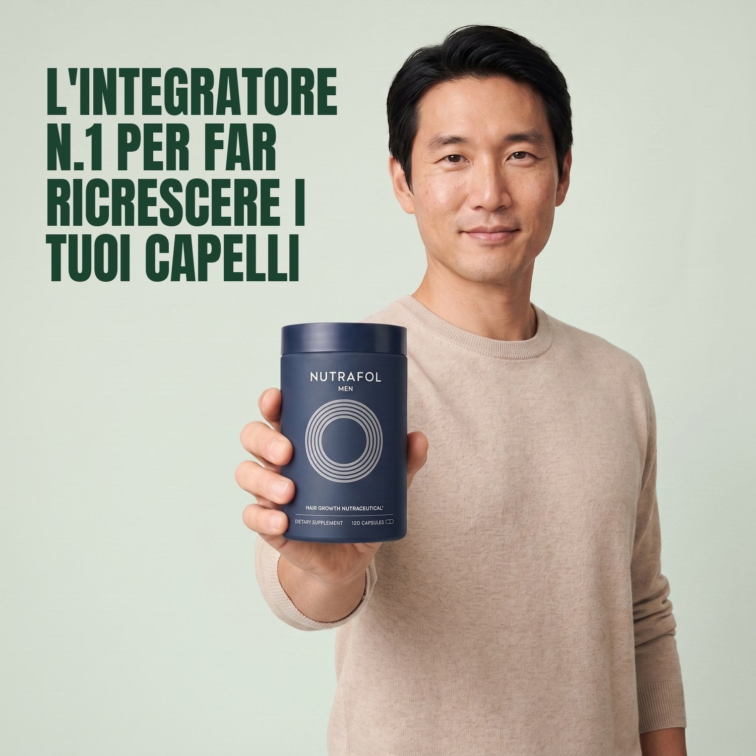Man holding the Nutrafol for Men supplement box against a green background