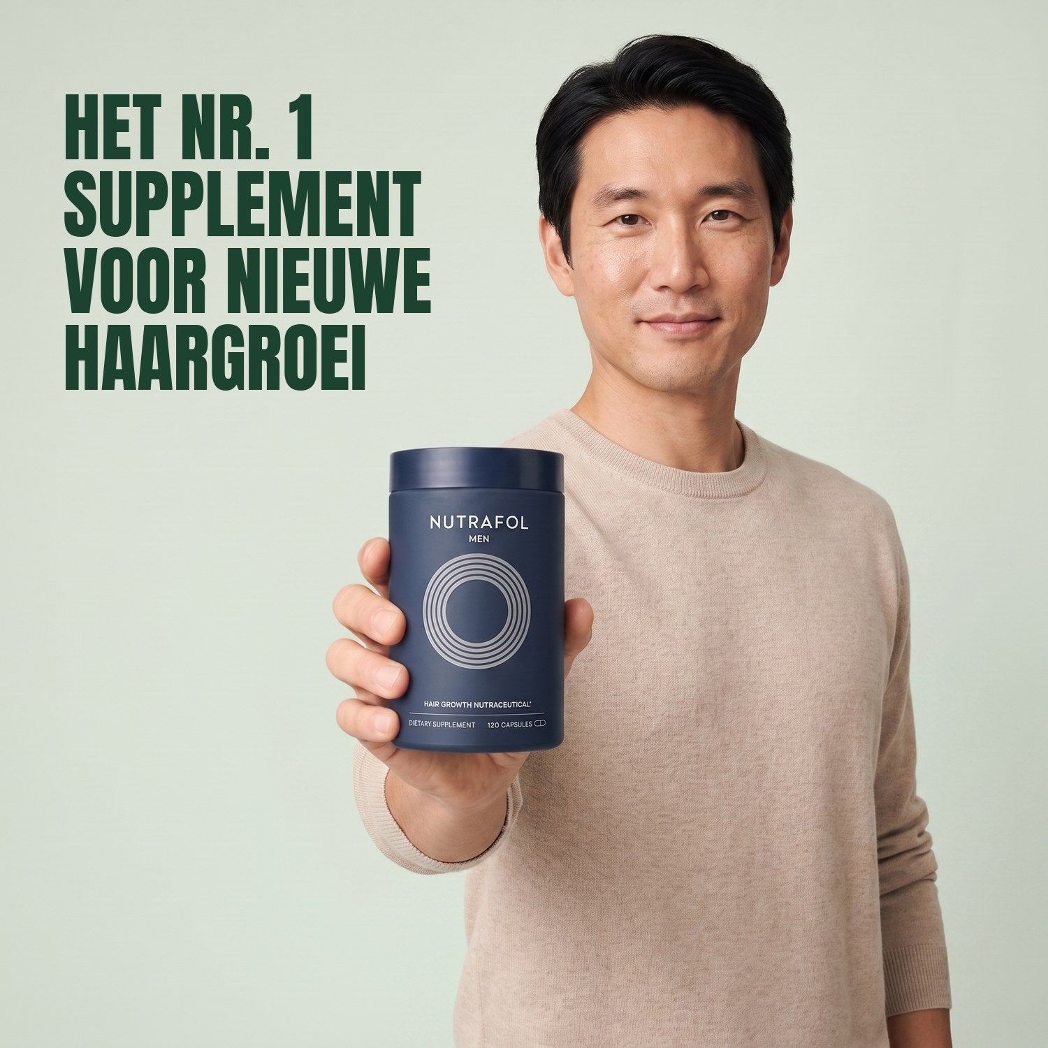 Man holding the Nutrafol for Men supplement box against a green background