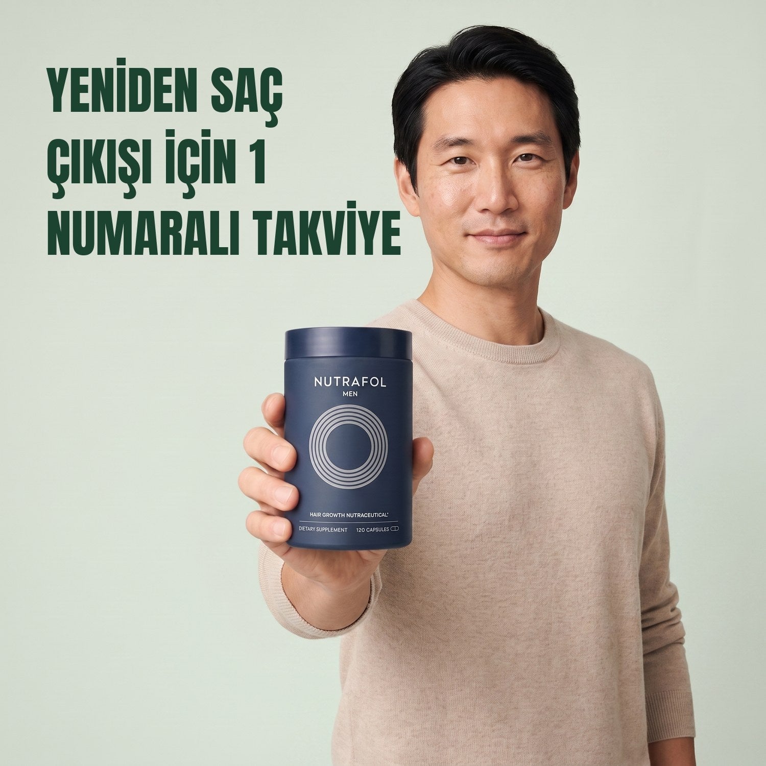 Man holding the Nutrafol for Men supplement box against a green background