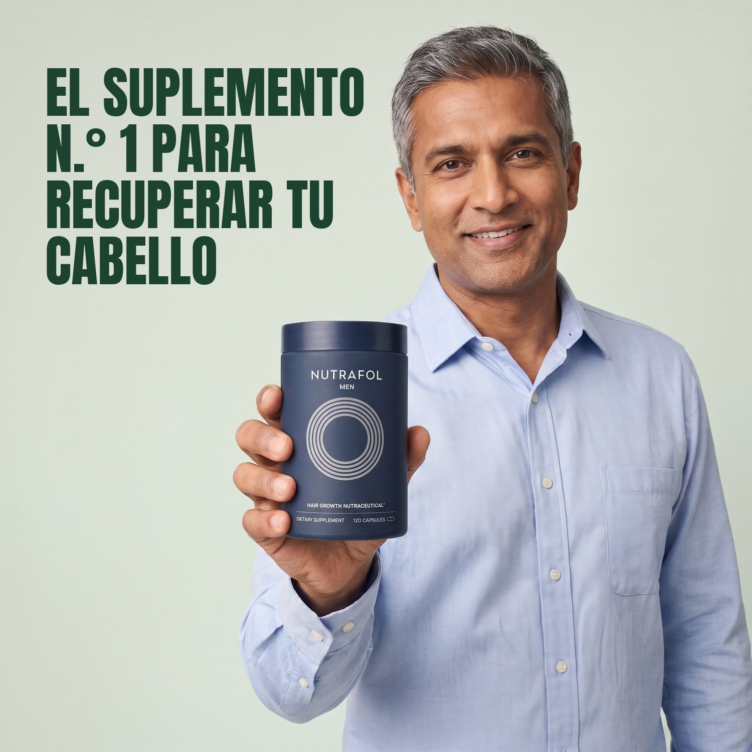 Man holding the Nutrafol for Men supplement box against a green background