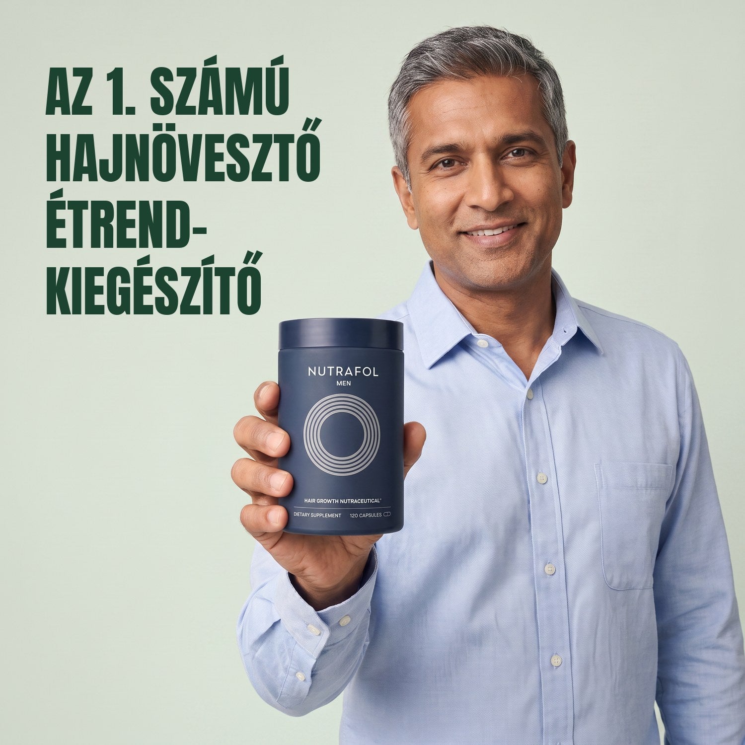 Férfi tartja a Nutrafol for Men étrend-kiegészítő dobozát, zöld háttér előtt
