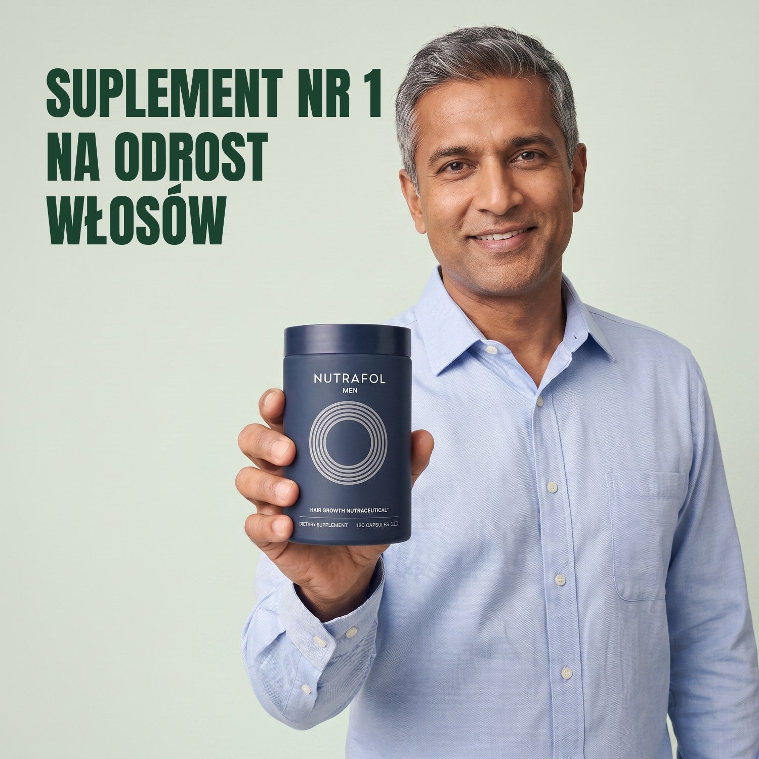 Mężczyzna trzyma pudełko suplementu Nutrafol for Men na zielonym tle