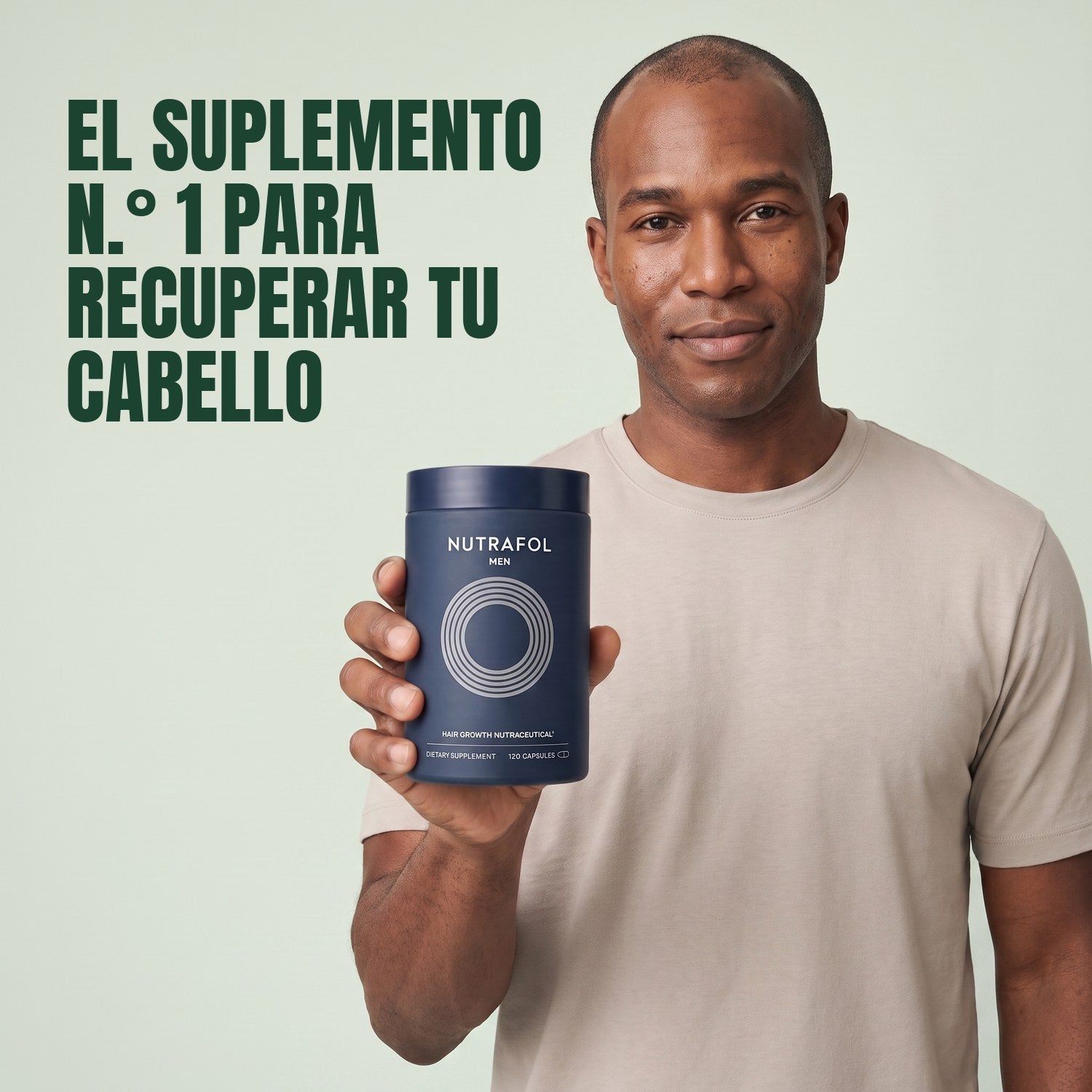 Man holding the Nutrafol for Men supplement box against a green background