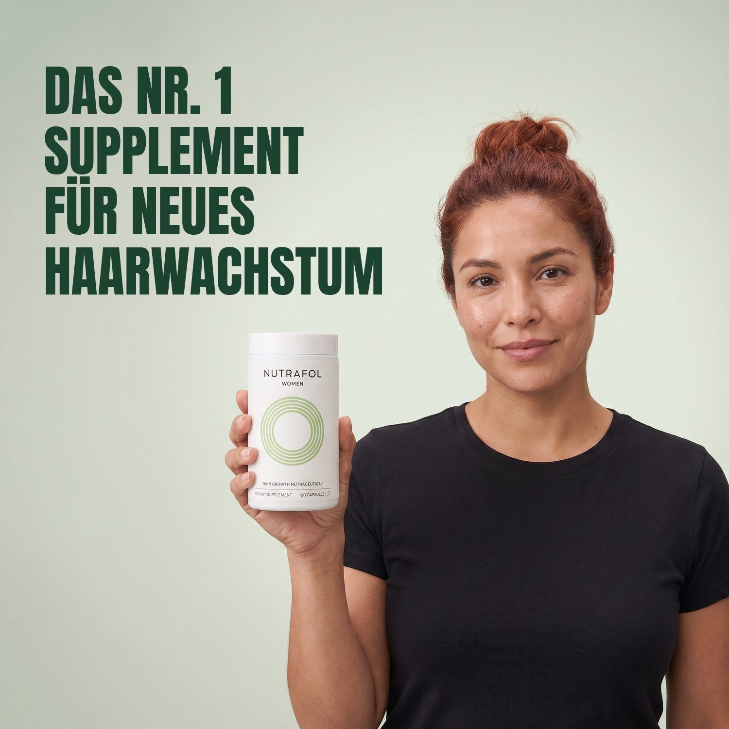 Woman holding the Nutrafol for Women 18-44 supplement box against a green background