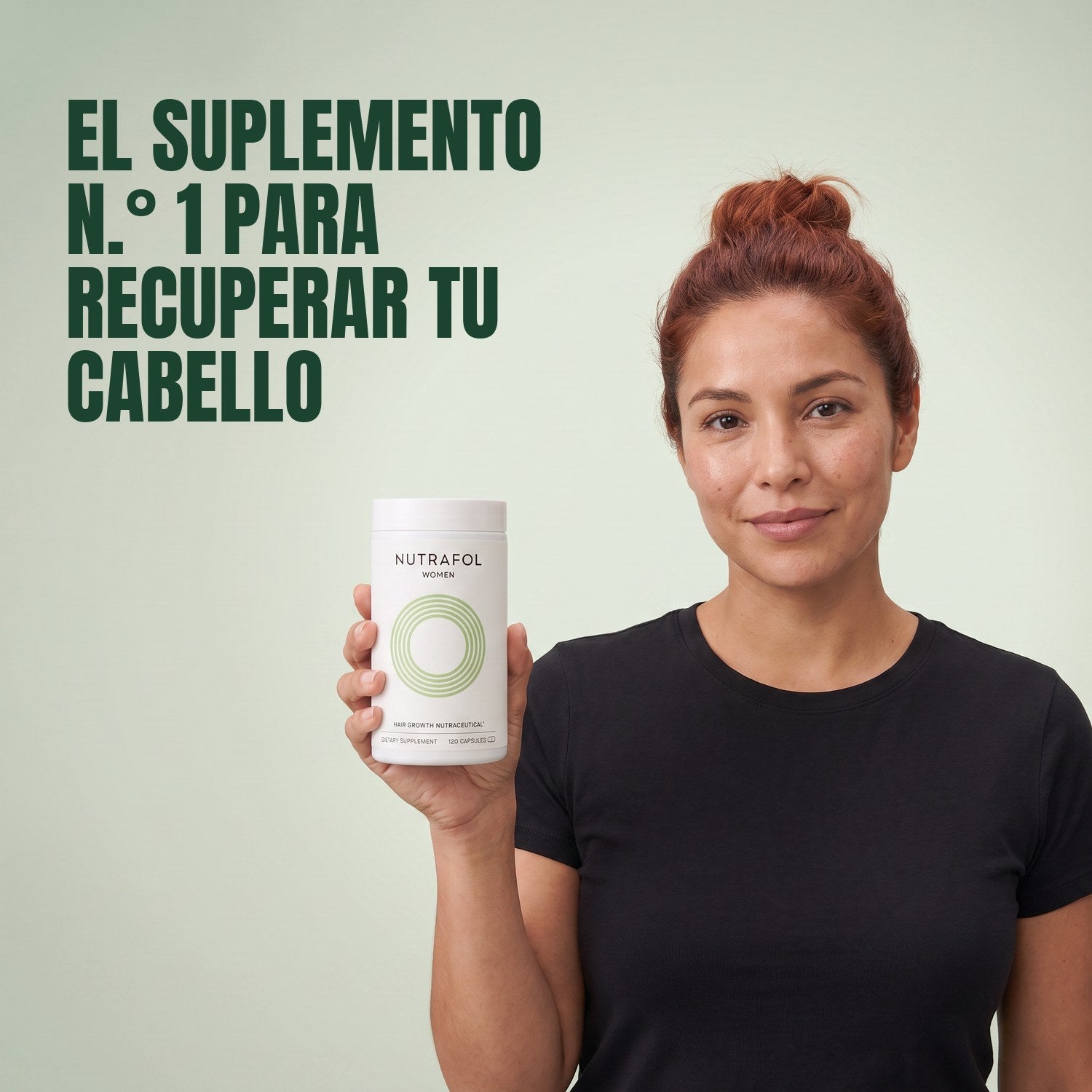 Woman holding the Nutrafol for Women 18-44 supplement box against a green background